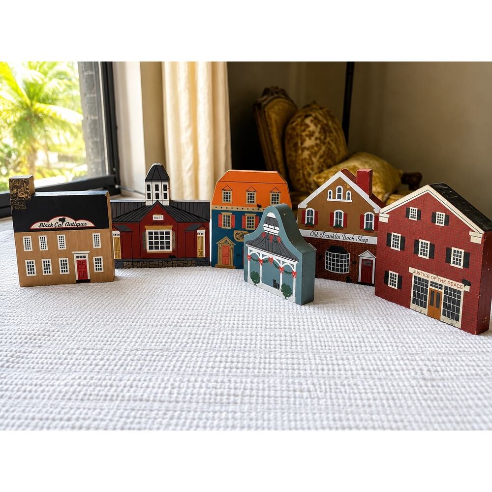 The Cat's Meow Village wooden replicas, which are collectible shelf-sitters